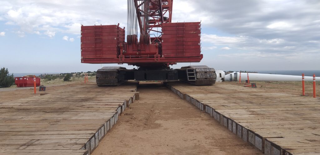 Eucalyptus crane mats providing lift support during wind turbine installation